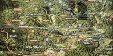 Mapa turystyczna z zaznaczonymi szlakami pieszymi i rowerowymi. Widać szczyt **czernica** 1083 m n.p.m., wsie i atrakcje.