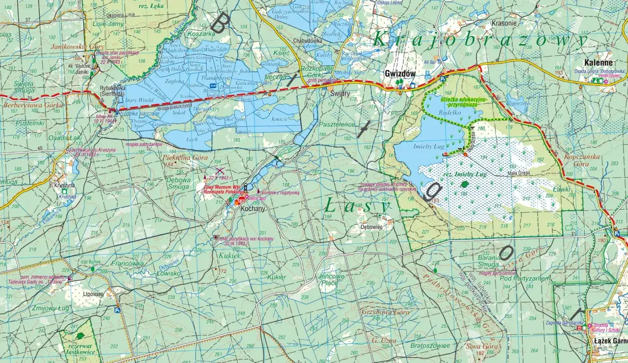 Mapa turystyczna przedstawiająca malownicze Lasy Janowskie z zaznaczonymi szlakami, rezerwatami i punktami widokowymi.